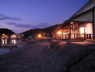 Holland House in the dusk and the stone wharf