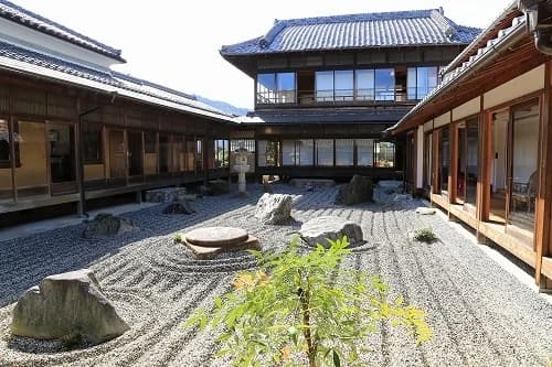 A remote building seen from the courtyard
