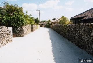 Red tile house and white sand road