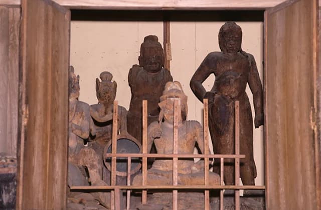 Standing wooden statue of Fudo Myo