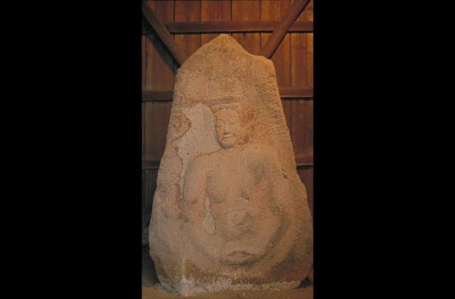 A seated statue of Maitreya Bodhisattva of stone structure