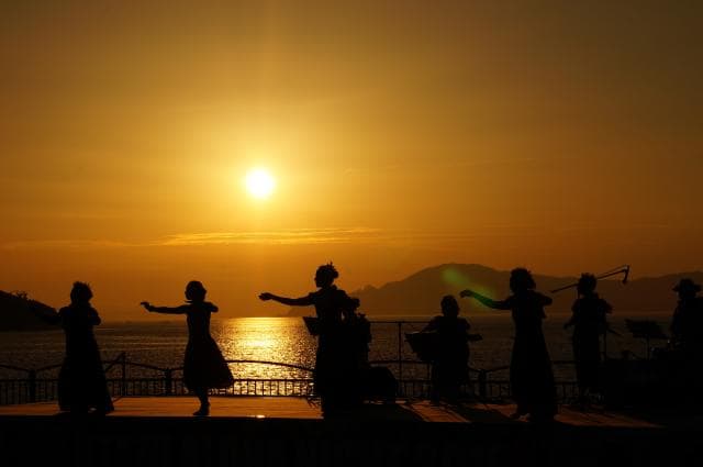 Beautiful sunset and hula co-starring